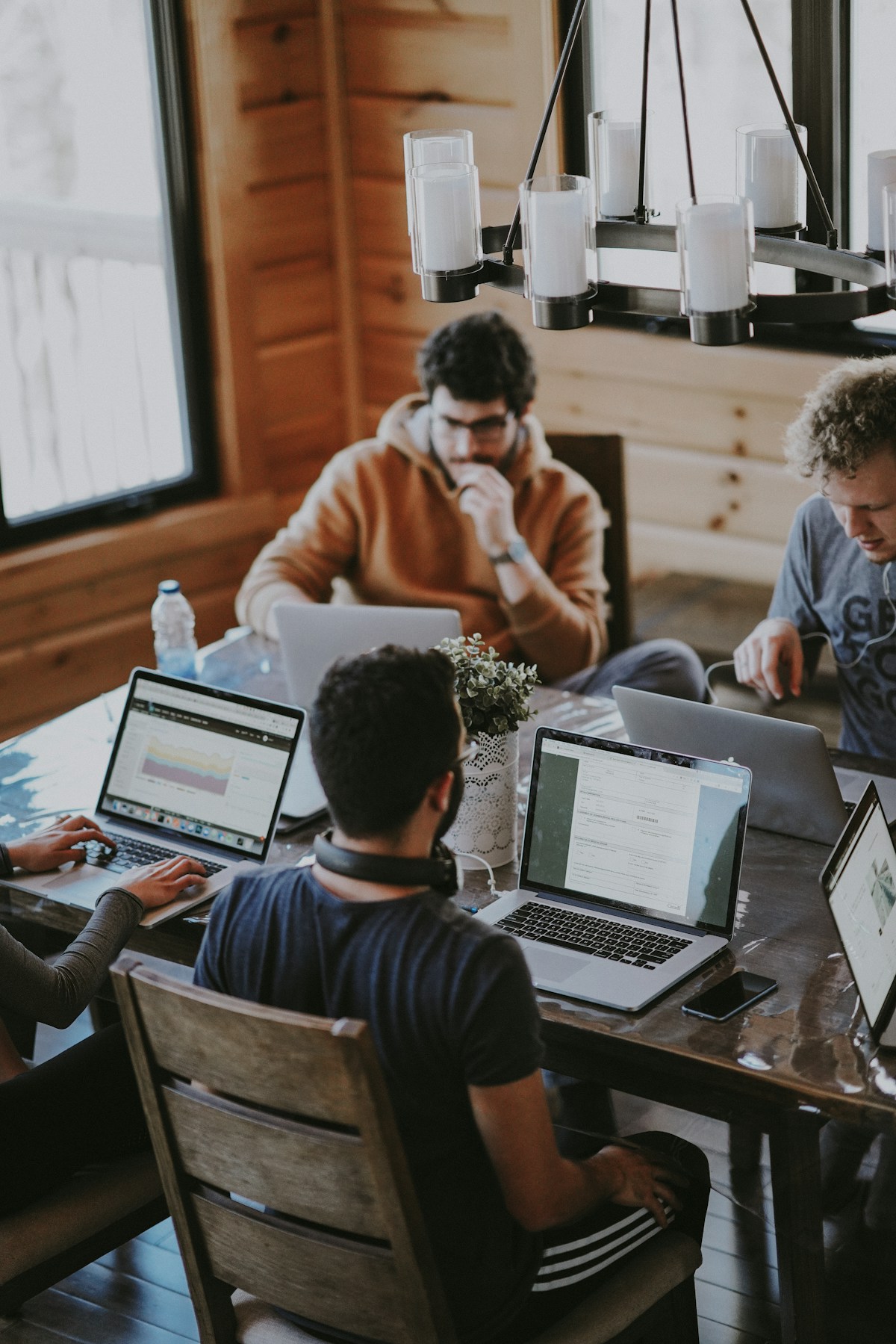 Professionals collaborating around a workplace table